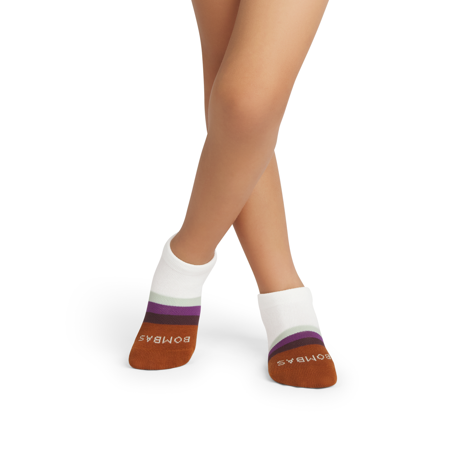 official-bombas::10093-softwhite-toffee-junior-unisex-onmodel-2-transparent.png
