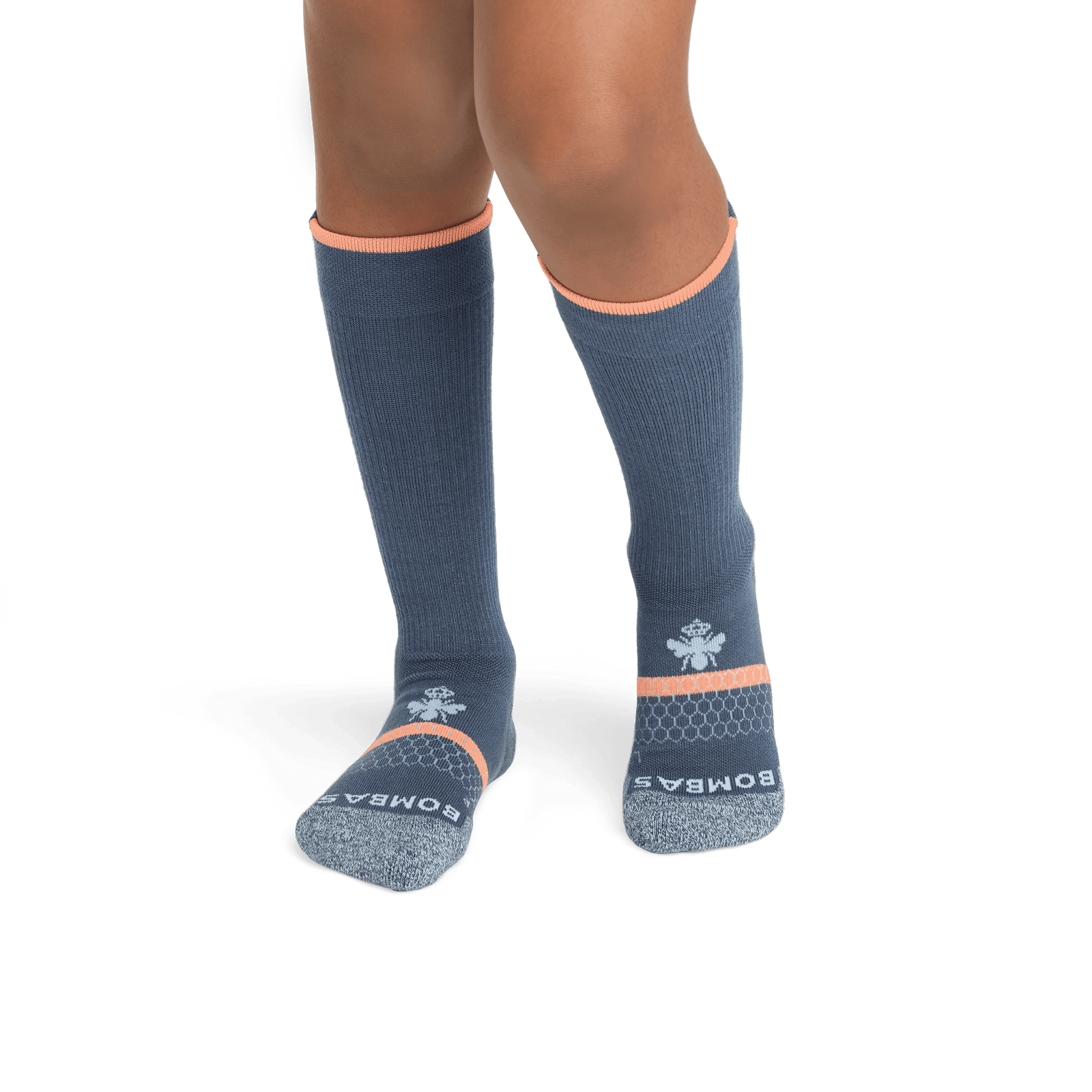 official-bombas::7166-storm-neonpeach-youth-unisex-2-transparent.png